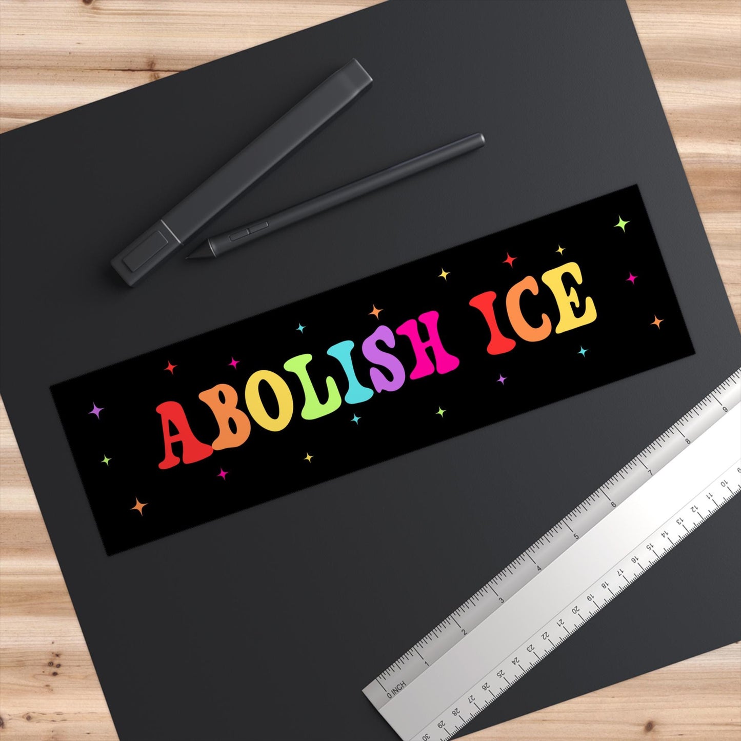 This picture features an up close view of the car magnet that we offer. Featuring bright rainbow letters along with sparkles, it makes a great fit for any car while making powerful political statement!