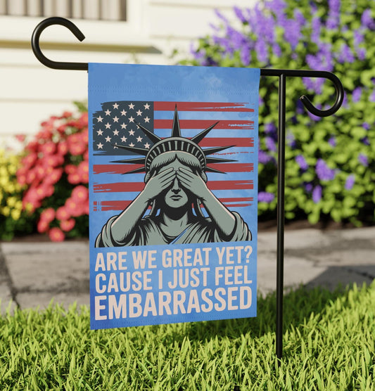 Blue lady liberty outdoor garden flag. Accented with an American flag and a slogan that states "Are we great yet? Cause I just feel embarrassed".