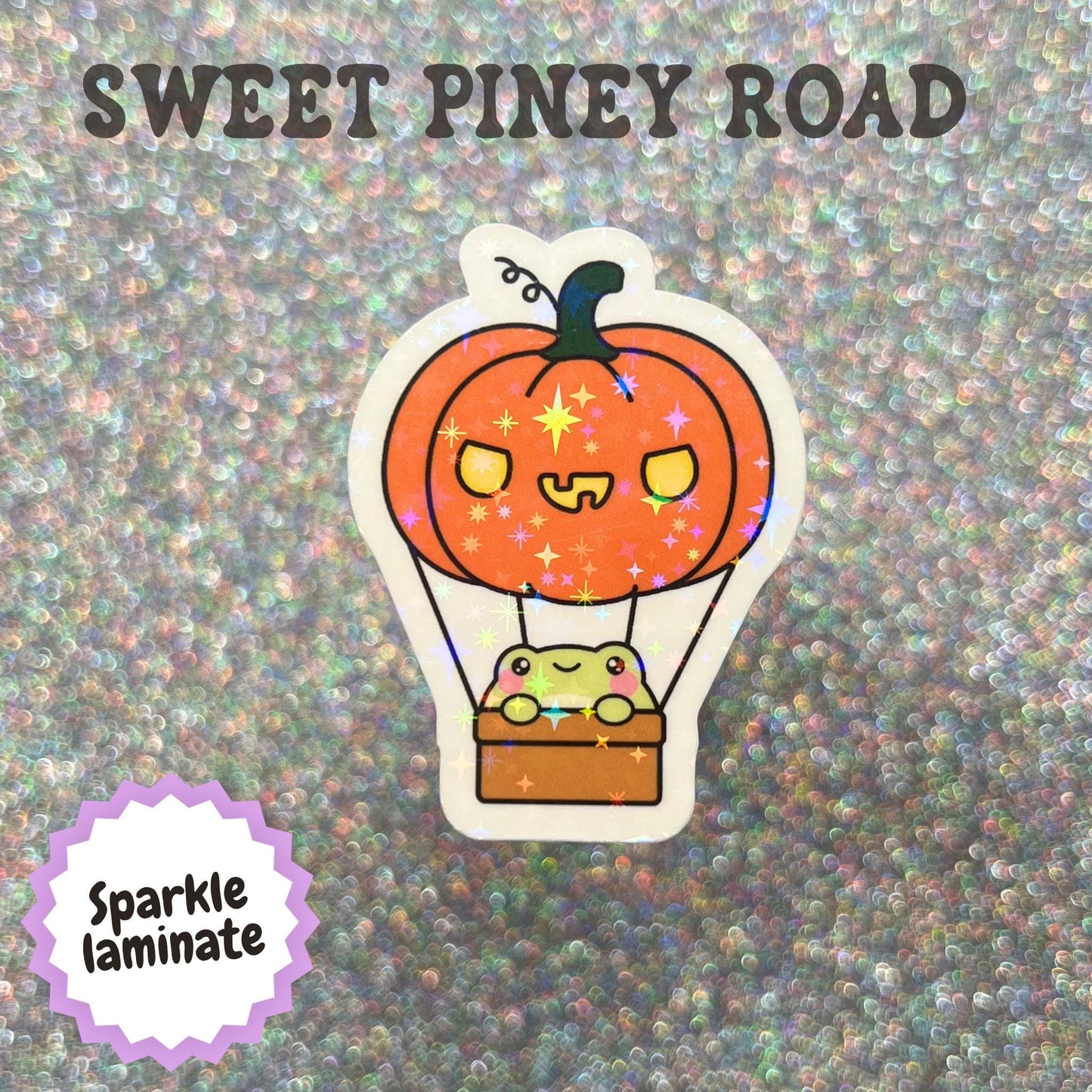 Cute kawaii toad riding in a pumpkin hot air balloon sticker featuring a smiling frog in a basket beneath an orange jack o lantern balloon with a whimsical Halloween theme.