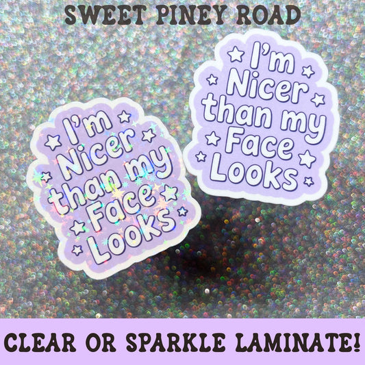 Lavender sticker featuring the phrase I'm Nicer Than My Face Looks surrounded by small stars in a cute retro-inspired design with a playful sarcastic message.