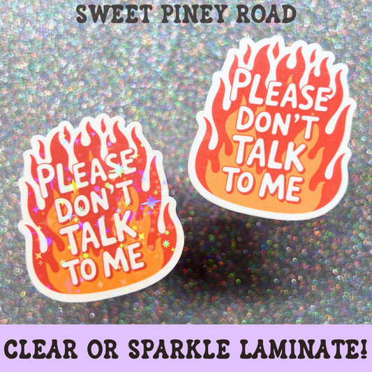 Funny sticker featuring the phrase Please Don't Talk To Me inside a stylized flame design, combining introvert humor with a bold sarcastic aesthetic.