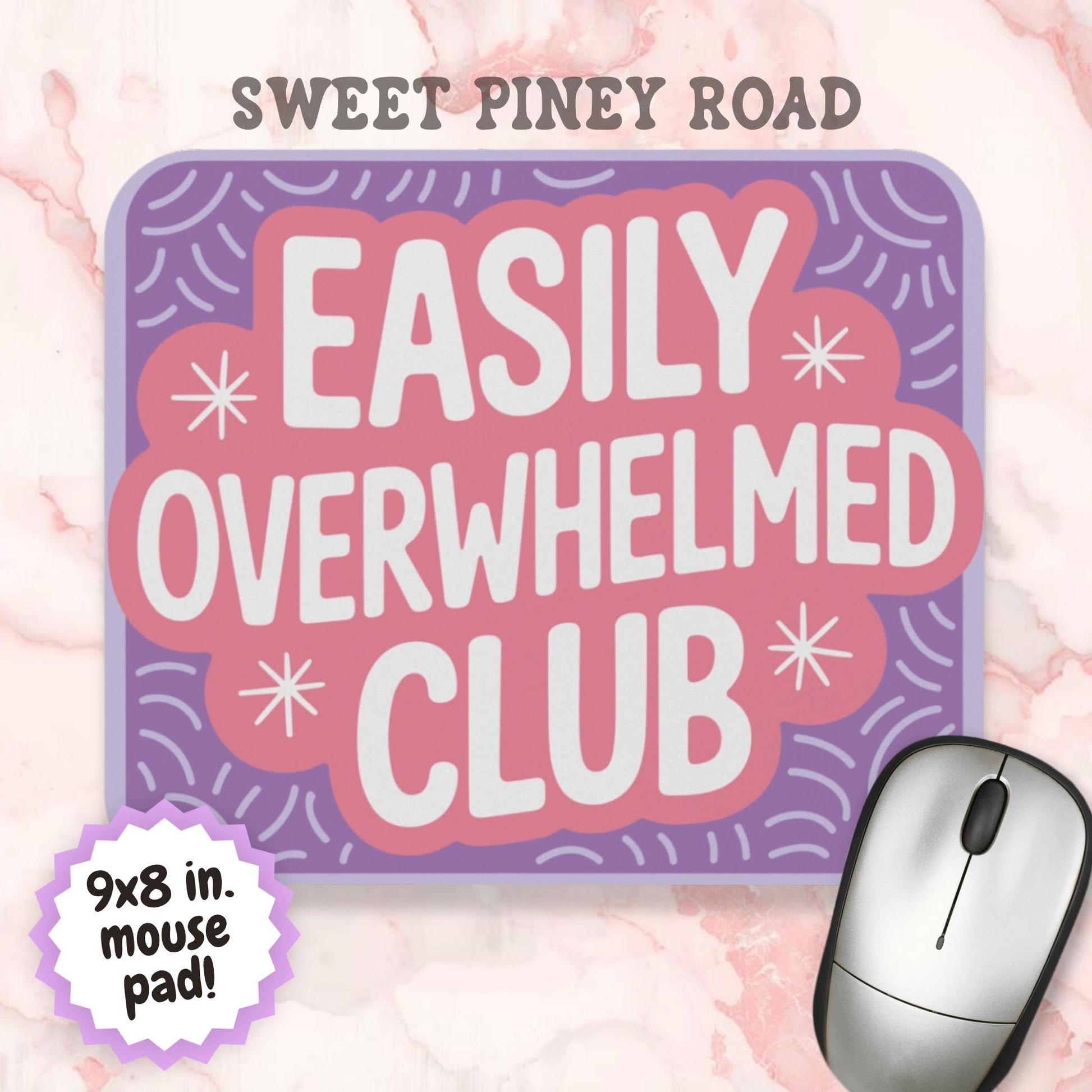 Pastel purple and pink mouse pad featuring the phrase "Easily Overwhelmed Club" in large white lettering. Colorful retro-style design with decorative starbursts and playful pattern accents, created as a humorous desk accessory for ADHD, anxiety, and mental health themed workspaces.