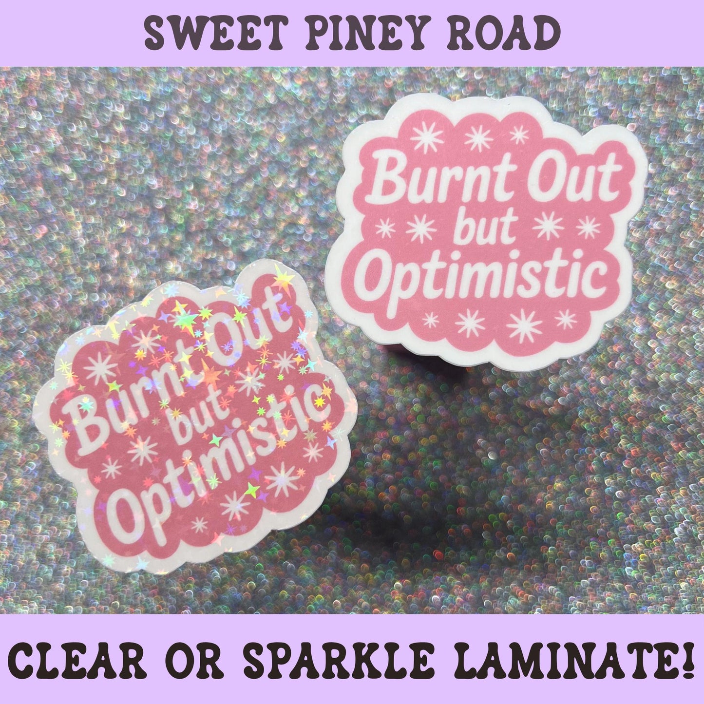 Pink die-cut sticker reading "Burnt Out But Optimistic" with retro typography and star accents on a white background.