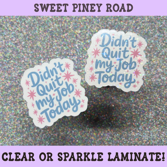 Pastel blue and pink sticker reading "Didn't Quit My Job Today" with retro star accents and playful typography.
