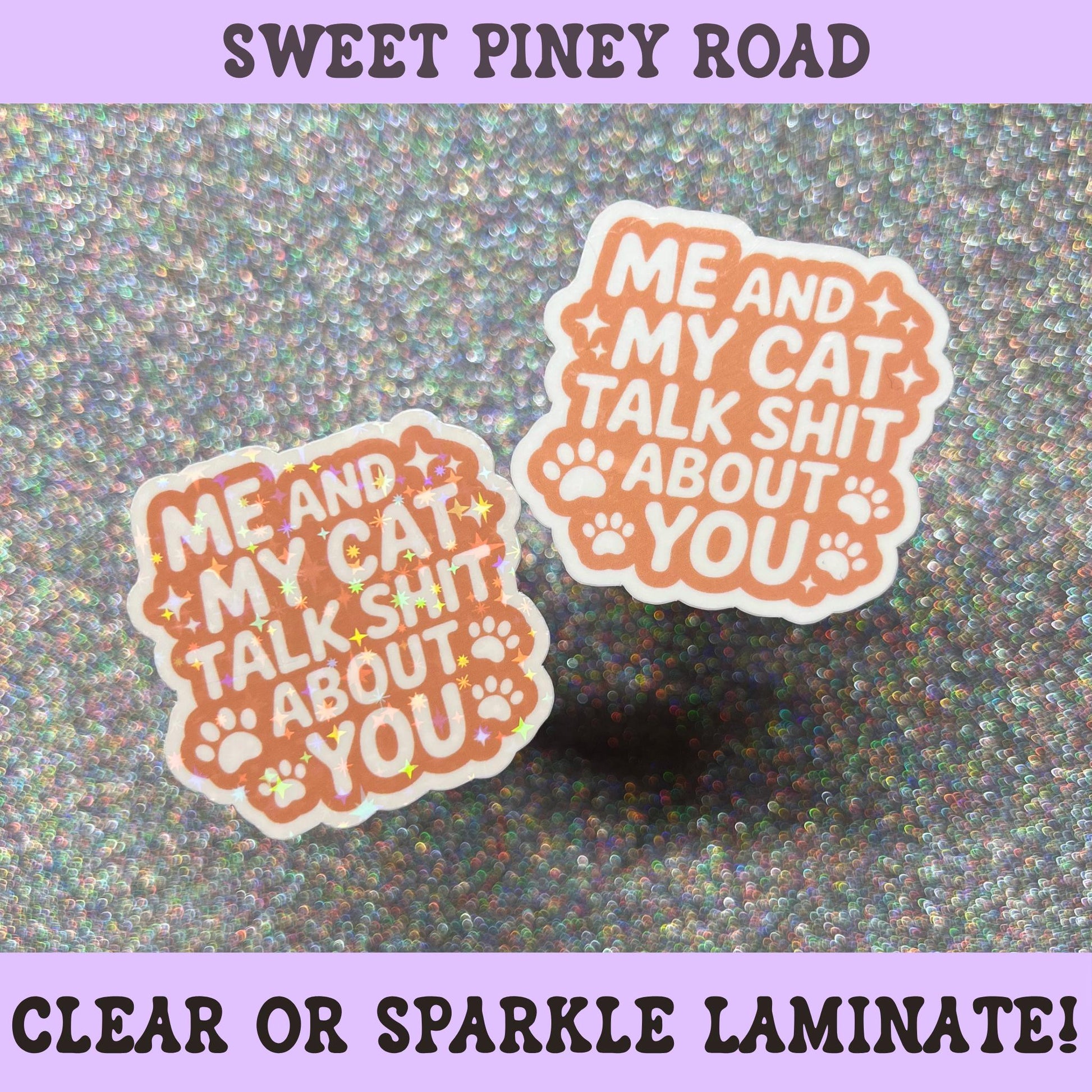 Funny cat sticker with the phrase "Me And My Cat Talk Shit About You" in orange lettering with paw prints, perfect for cat lovers and sarcastic humor fans.