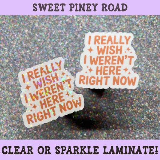 Funny quote sticker reading "I Really Wish I Weren't Here Right Now" in peach lettering with sparkles, relatable introvert and social anxiety humor sticker.