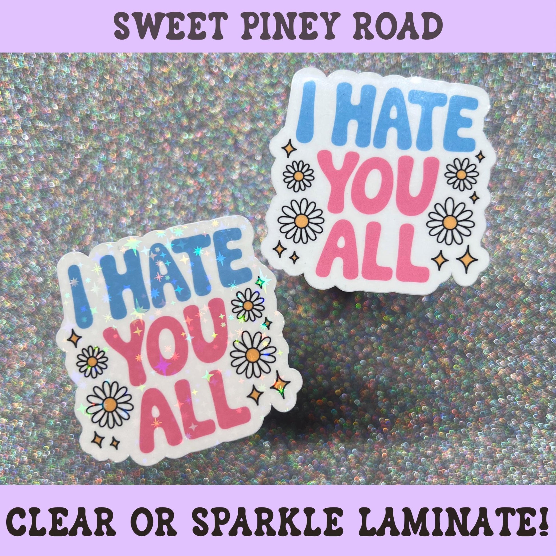 Sparkly floral sticker featuring daisies and the phrase "I Hate You All" in blue and pink retro lettering.