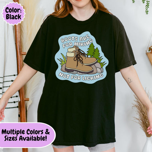 Funny hiking-themed graphic featuring a pair of hiking boots on a trail with the phrase "Boots Are For Hiking Not For Licking," combining outdoor adventure imagery with anti-Trump political humor and bootlicker satire.