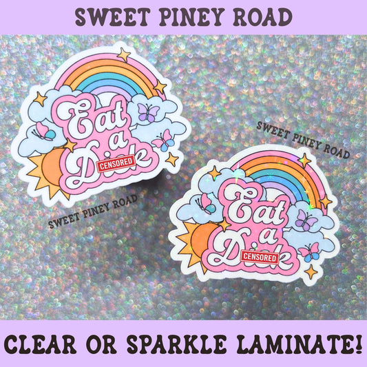 Pastel rainbow sticker featuring clouds, butterflies, and the phrase Eat A Dick in pink retro lettering.