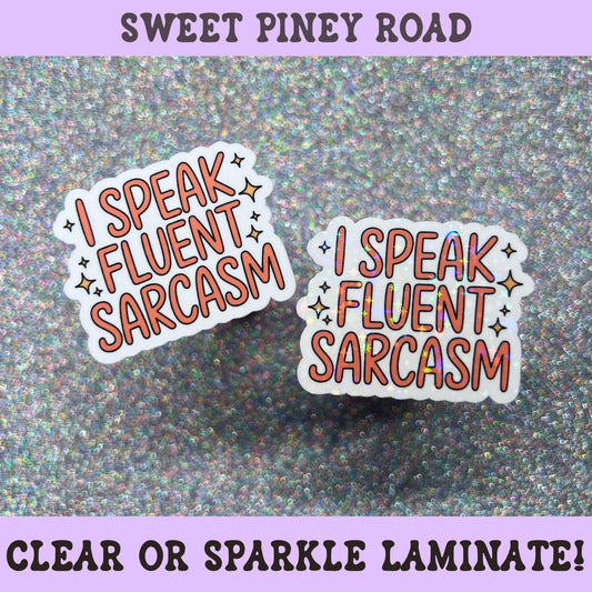 Typography sticker featuring the phrase I Speak Fluent Sarcasm in coral lettering with decorative star accents.