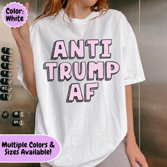 Minimalist political typography design featuring the phrase "Anti Trump AF" in large pink block letters on a black background.