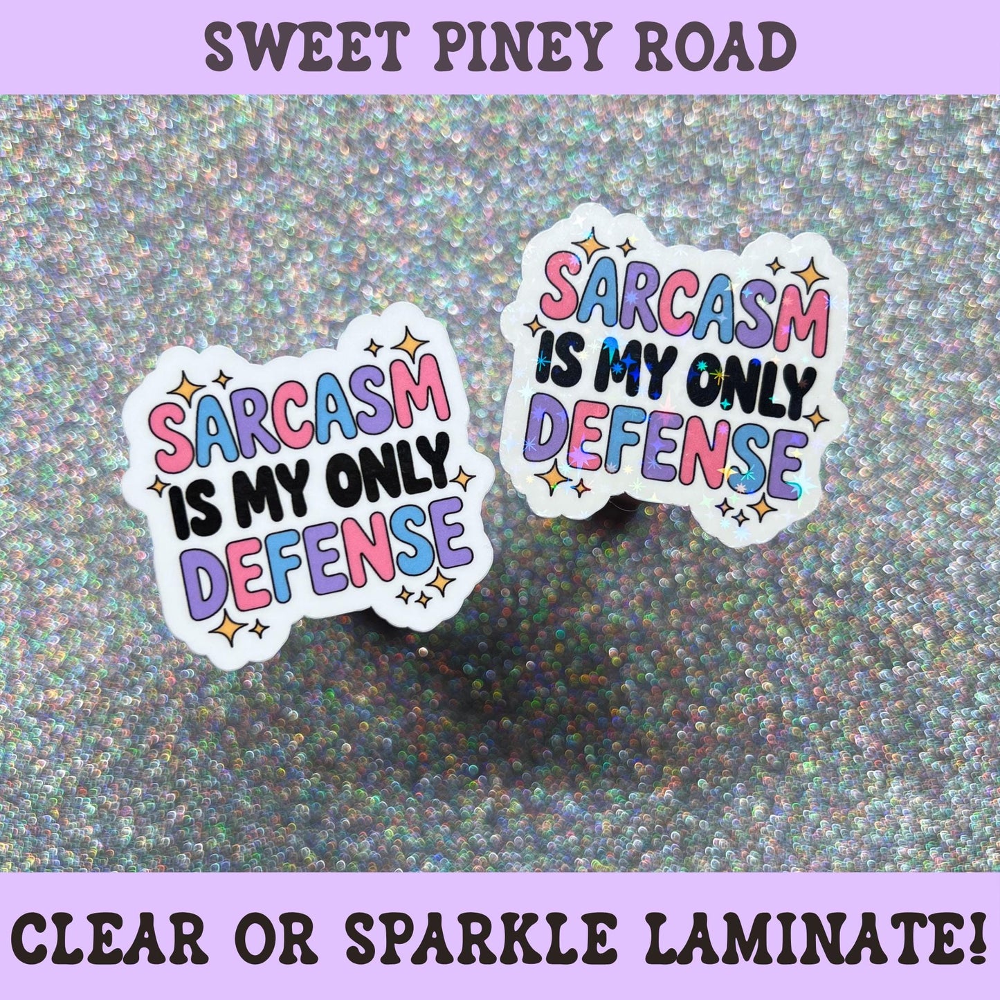 Colorful sticker featuring the phrase "Sarcasm Is My Only Defense" in pink, blue, purple, and black lettering with decorative stars.